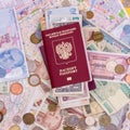 Passport with paper money and coins. Flatlay of vacation on a yellow background Royalty Free Stock Photo