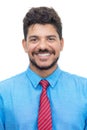 Passport photo of happy laughing latin american businessman with beard