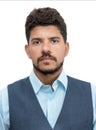 Passport photo of serious latin american businessman with beard