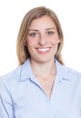 Passport picture of a blonde german woman in blue blouse