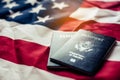 Passport is placed on the US flag. Preparing for a legitimate journey