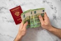 Passport of the Russian Federation and euro banknotes. Concepts of travel, economic sanctions