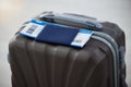 Passport, suitcase and plane ticket for travel safety in airport for immigration, holiday or vacation. Luggage, document