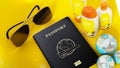 Passport, sunglasses, sun cream, globes on yellow background. 3D illustration