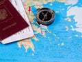 Passport with tickets and compass on a tourist map Royalty Free Stock Photo