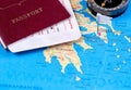 Passport with tickets and compass on a tourist map for travel and recreation Royalty Free Stock Photo