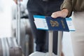 Passport, travel and airport with the hand of a passenger holding documents while waiting for a flight. Immigration Royalty Free Stock Photo