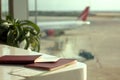 Passports and boarding passes on a table in an airport lounge Royalty Free Stock Photo