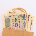 Japanese yen currency in a brown paper bag.. Royalty Free Stock Photo