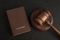 Passports and judge gavel on gray black background. Legal immigration. Obtain citizenship Royalty Free Stock Photo