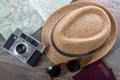 Passports, map, summer hat and camera ready for holidays Royalty Free Stock Photo