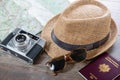 Passports, map, summer hat and camera ready for holidays Royalty Free Stock Photo