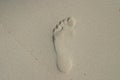 Past symbol- foot step on a sand Royalty Free Stock Photo