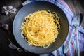 Pasta aglio olio on a plate dark mood photo
