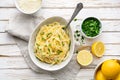 Pasta al Limone, delicious Italian meal, spaghetti with Parmesan, butter and lemon sauce, topped with fresh grated zest and cheese