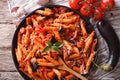 Pasta alla Norma close-up and ingredients. horizontal top view Royalty Free Stock Photo