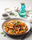 Pasta alla Norma. Traditional Italian dish with eggplant, tomato sauce, ricotta cheese and basil in plate on concrete background Royalty Free Stock Photo