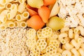 Pasta background assortment of different kinds italian macaroni in chess cells top view.