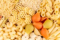 Pasta background assortment of different kinds italian macaroni in chess cells top view.