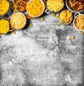 Pasta background. Many different pasta in bowls. Royalty Free Stock Photo