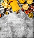 Pasta background. Various pasta with vegetables and spices. Royalty Free Stock Photo