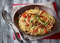 Pasta with baked sweet pepper, garlic, herb oil and pine nuts