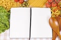 Italian pasta recipe ingredients, cookbook with blank pages, white copy space Royalty Free Stock Photo