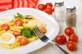 Pasta with boiled eggs, tomatoes, parsley, fork, salt, pepper, t Royalty Free Stock Photo