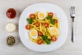 Pasta with boiled eggs, tomatoes, parsley, mayonnaise, ketchup, Royalty Free Stock Photo