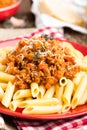 Pasta bolognese. Pasta served with a sauce of ground beef meat, tomato, onion, carrot and thyme Royalty Free Stock Photo