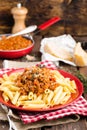 Pasta bolognese. Pasta served with a sauce of ground beef meat, tomato, onion, carrot and thyme Royalty Free Stock Photo