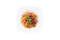 Pasta Bolognese with tomato sauce, minced beef, garlic, basil on white plate. Spaghetti isolated on white background Royalty Free Stock Photo