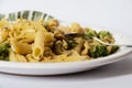 Pasta with broccoli on a white plate