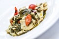 Pasta called maltagliati with turnip greens, and cherry tomatoes Royalty Free Stock Photo