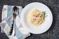 Pasta carbonara served on deep plate decorated with rosemary. Dinner. Royalty Free Stock Photo