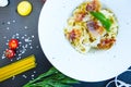 Pasta Carbonara. Spaghetti with bacon and parmesan cheese on dark background Royalty Free Stock Photo