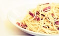 Pasta carbonara spaghetti with ham, bacon and fresh parmesan on the white plate in restaurant in Catania, Sicily, Italy Royalty Free Stock Photo