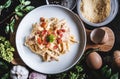 Pasta Carbonara in white dish, surround fresh ingredient