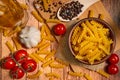 Pasta in a ceramic bowl, cherry tomatoes, garlic, olive oil