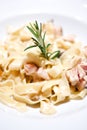 Pasta with champignons, chicken and sauce and thyme on white background. .