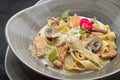 Pasta with chicken, mushrooms, sauce and cheese, close-up Royalty Free Stock Photo
