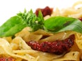 Pasta Collection - Tagliatelle with Salmon, Basil and Dried Tomatoes Royalty Free Stock Photo