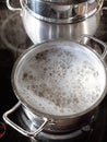 pasta cooking in boiling water in saucepan at home Royalty Free Stock Photo