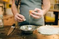 Pasta cooking process, male chef hands with egg Royalty Free Stock Photo