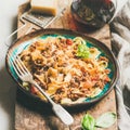 Pasta dinner with tagliatelle bolognese and red wine, square crop Royalty Free Stock Photo