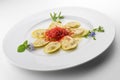 Pasta dish with Crustaceans ravioli with berries