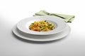 Pasta dish Macaroni and vegetables with napkin and fork