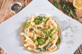 Pasta dish with a sour cream and herbs on wooden boards Royalty Free Stock Photo