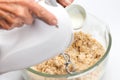 Pasta dough preparation - adding milk Royalty Free Stock Photo