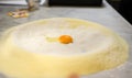 Pasta dough preparation- fresh yolk and flour Royalty Free Stock Photo